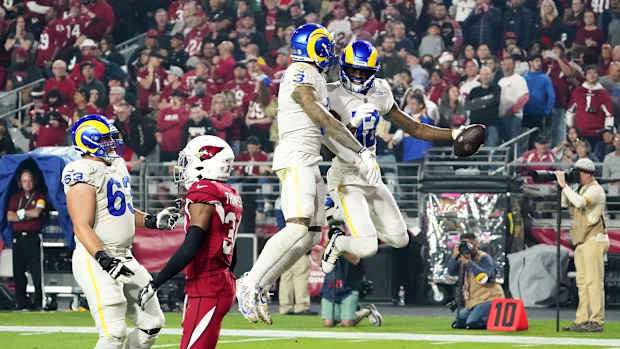 Dec 13, 2021; Glendale, Arizona, USA; Los Angeles Rams wide receiver Van Jefferson (12) celebrates his touchdown catch with wide receiver Odell Beckham Jr. (3) in front of Arizona Cardinals free safety Jalen Thompson (34) at State Farm Stadium. Mandatory Credit: Rob Schumacher-Arizona Republic

Nfl Los Angeles Rams At Arizona Cardinals
